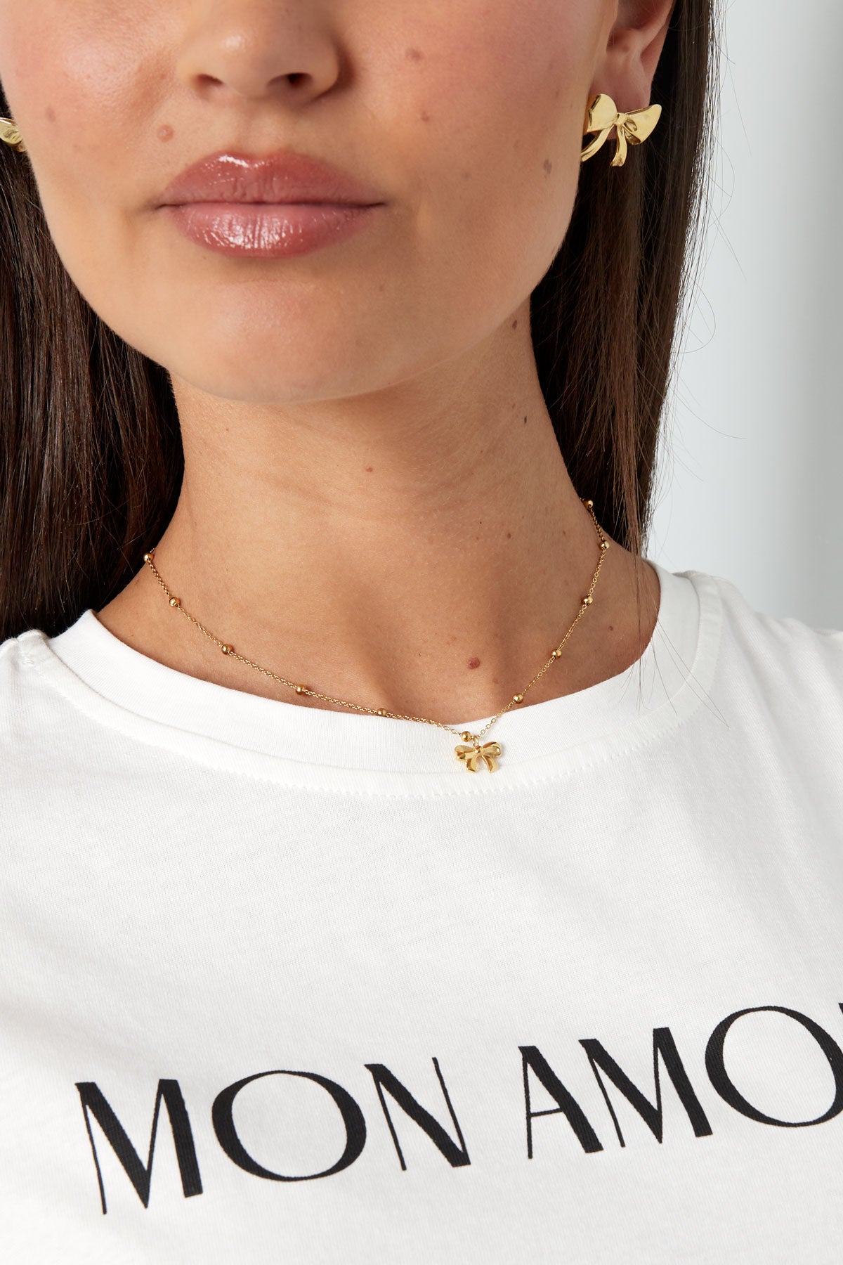 Collier avec boules et noeud - doré