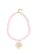 Collier de perles avec pendentif soleil