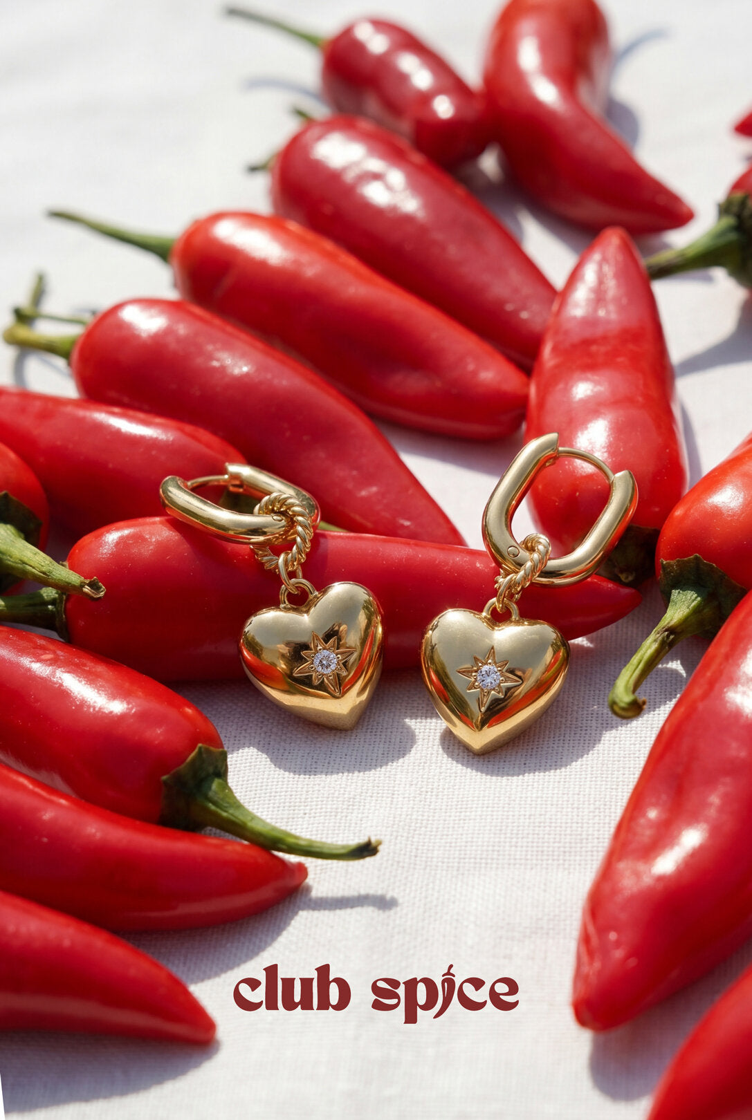 Boucles d'oreilles ovales avec pendentif en forme de cœur et pierre