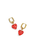 Boucles d'oreilles avec des cœurs pendants à pois