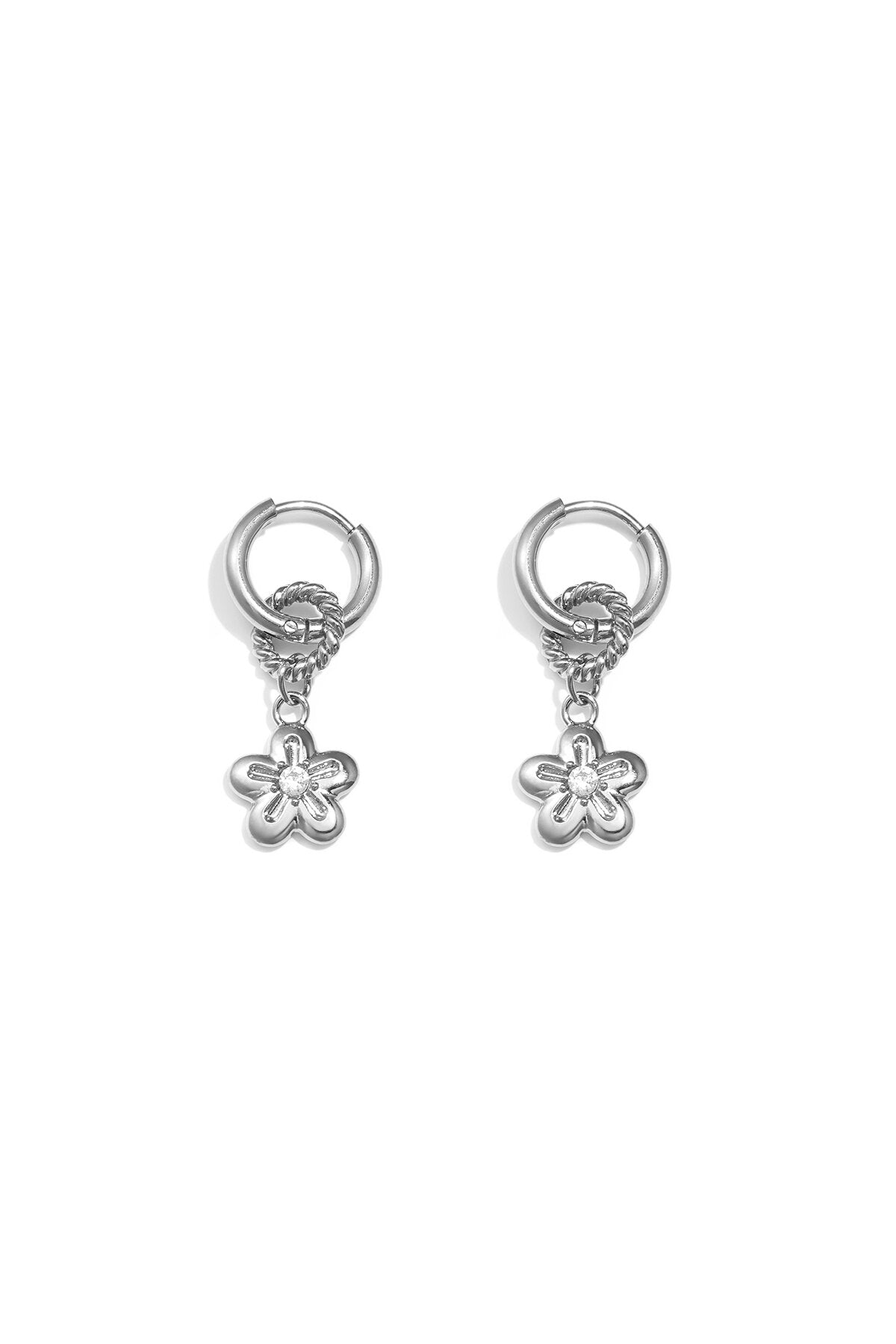 Boucles d'oreilles avec une marguerite pendante