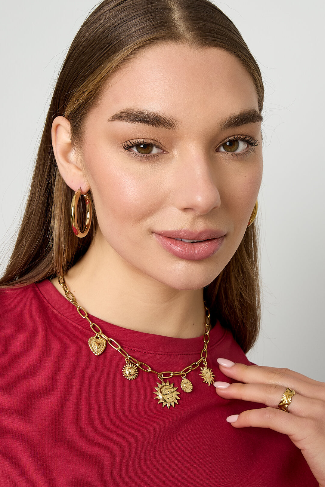 Collier avec breloques soleil et cœur