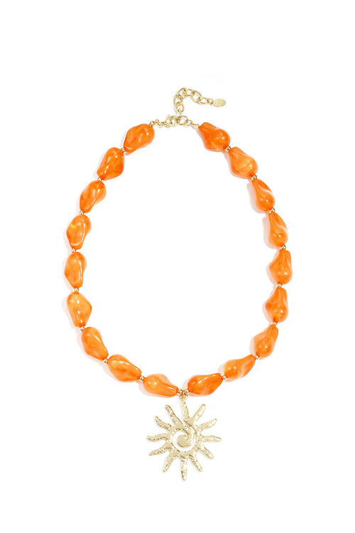 Collier de perles avec pendentif soleil